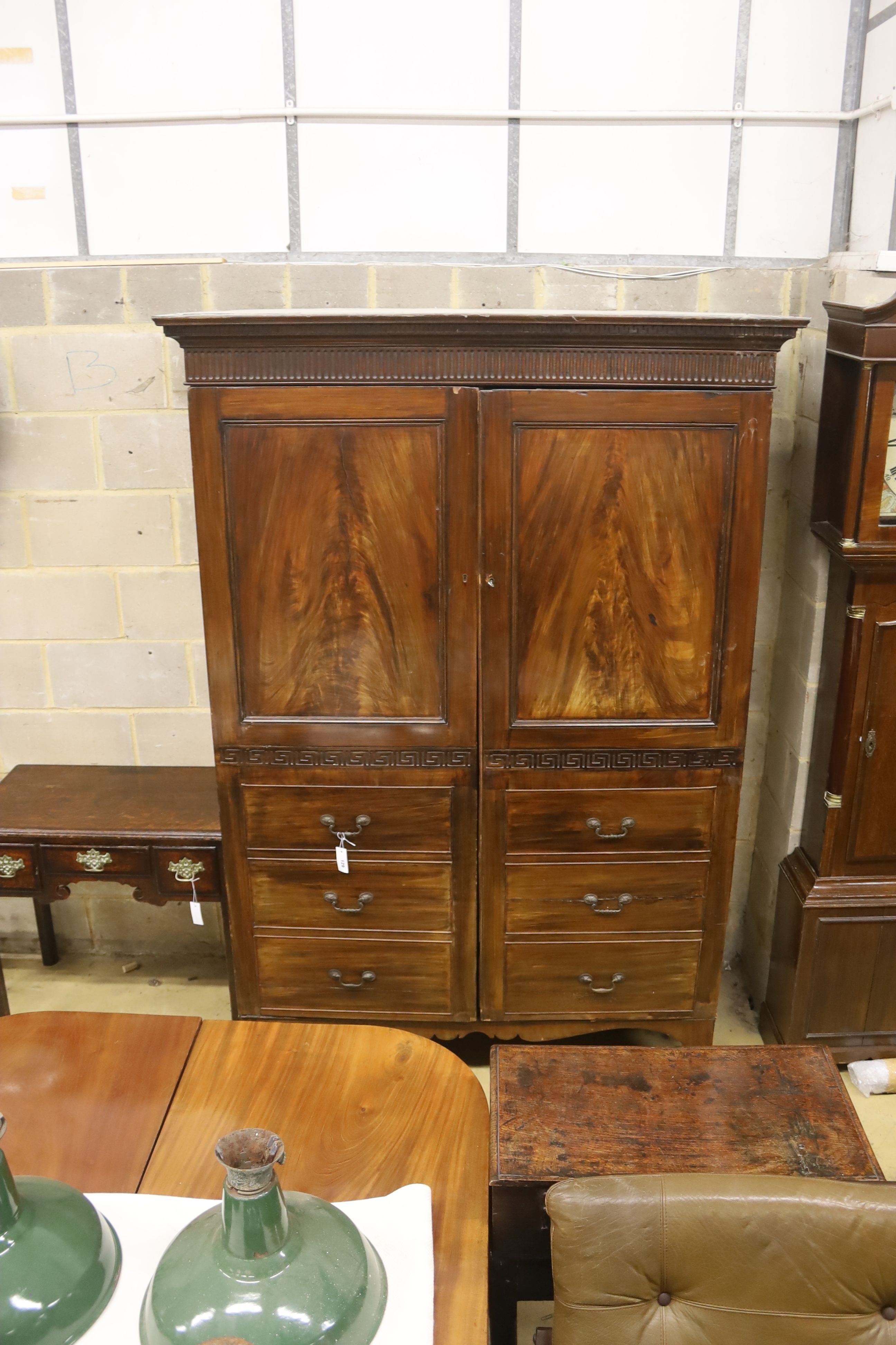 A George III style mahogany hanging cupboard, width 142cm, depth 65cm, height 209cm